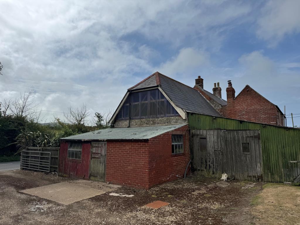 Lot: 53 - TRADITIONAL FARMHOUSE FOR IMPROVEMENT WITH BARNS AND OUTBUILDINGS ON A 2.5 ACRE PLOT - A Sider View from the Farmyard Showing the Barns